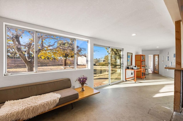 interior space featuring concrete floors and a textured ceiling