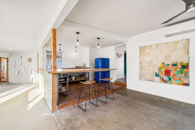 bar featuring hanging light fixtures, ceiling fan, blue cabinetry, concrete flooring, and a wall unit AC