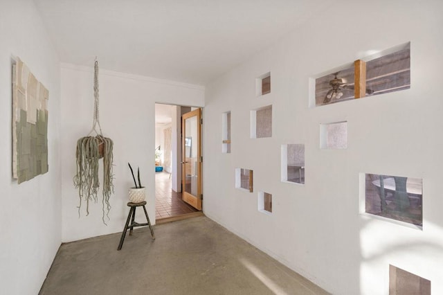 hallway with concrete floors