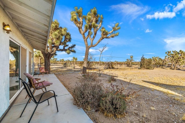 view of patio with a rural view