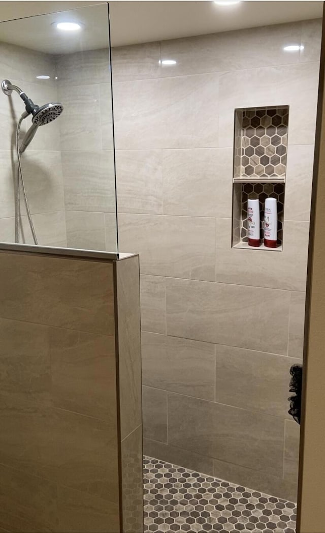 bathroom with tiled shower