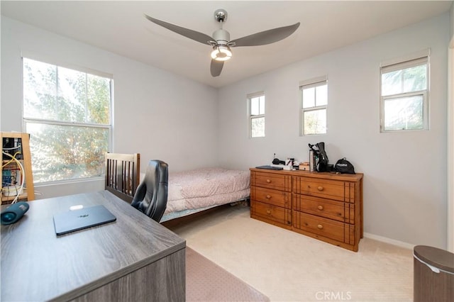 bedroom with ceiling fan and light colored carpet