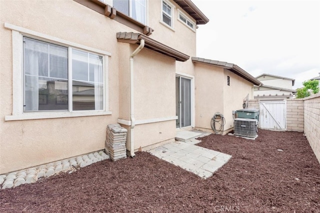 view of side of property with central AC