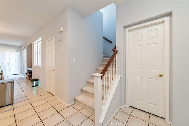 staircase with tile patterned floors