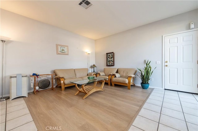 living room with light hardwood / wood-style floors