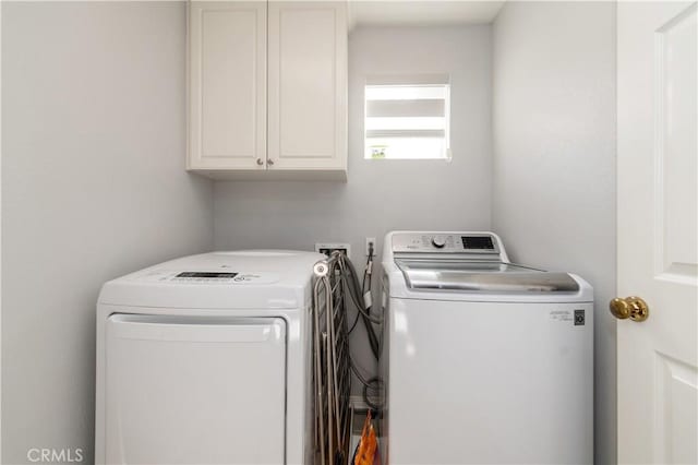 laundry area featuring cabinets and washer and dryer