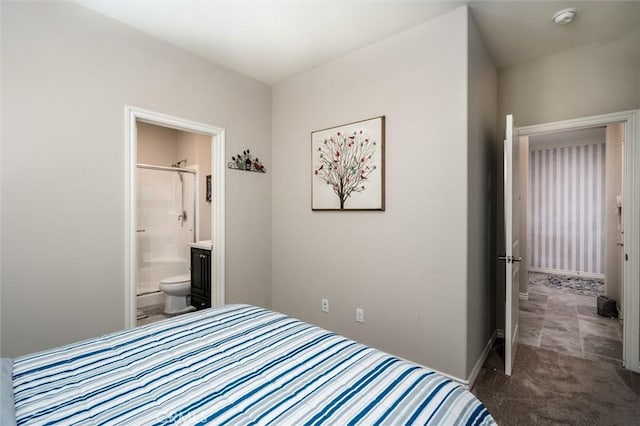 carpeted bedroom featuring ensuite bathroom