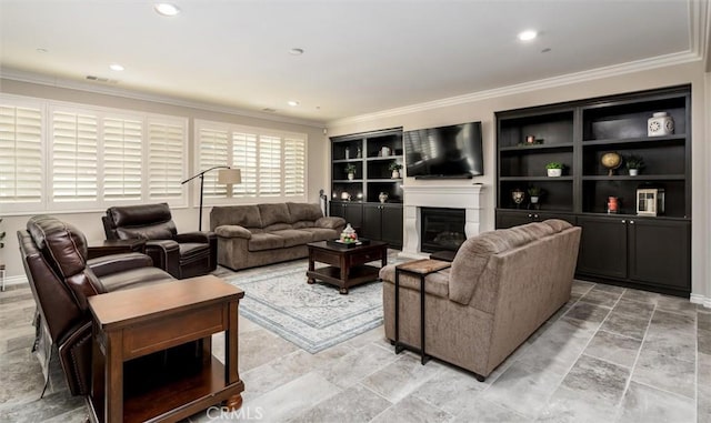 living room with built in features and ornamental molding