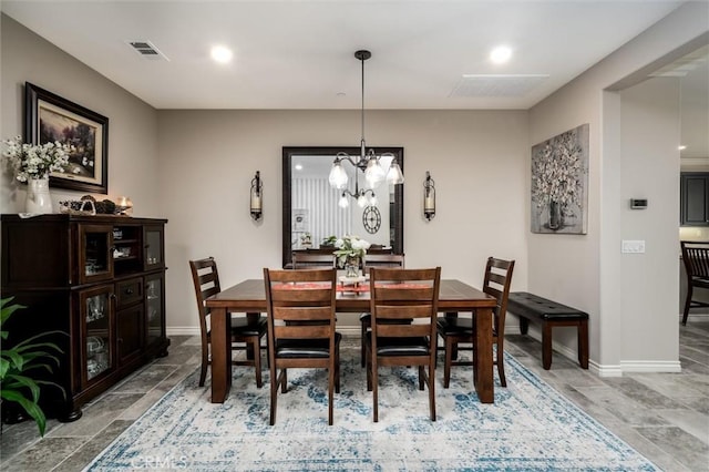 dining room featuring a chandelier