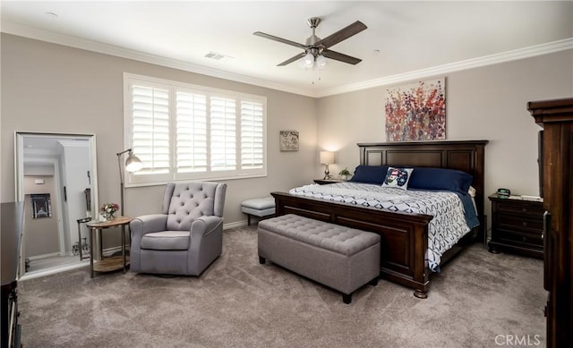 carpeted bedroom featuring visible vents, crown molding, and ceiling fan