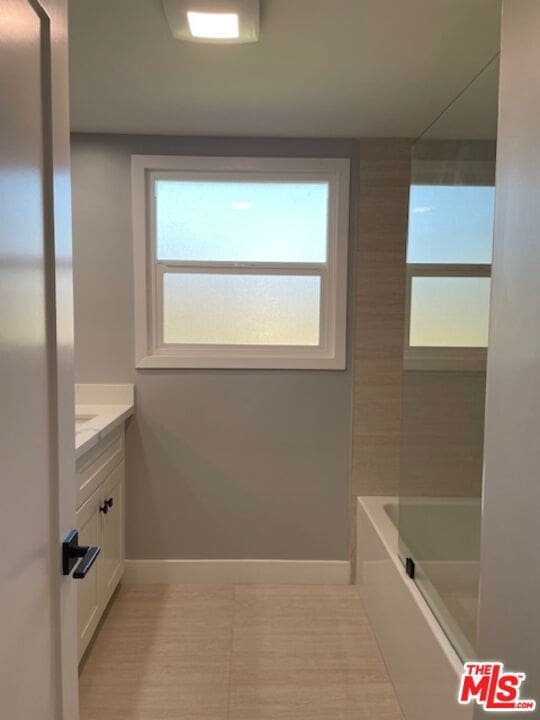 bathroom featuring shower / bathing tub combination and vanity