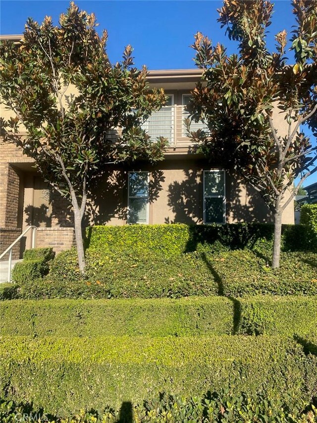 view of property hidden behind natural elements