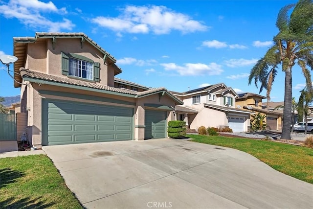 view of front of home featuring a garage and a front lawn