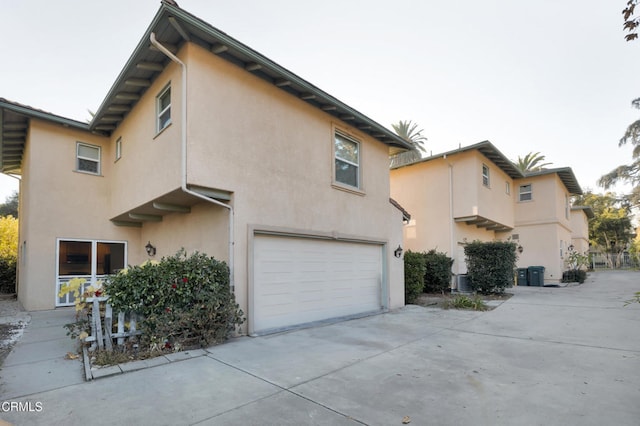 view of side of property with a garage