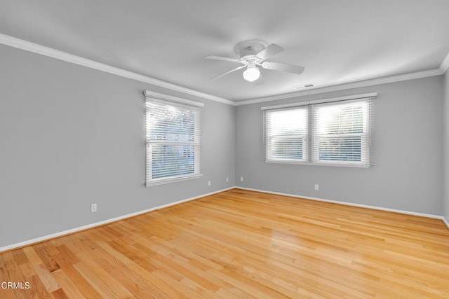 empty room featuring crown molding, light hardwood / wood-style flooring, and ceiling fan