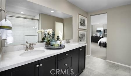 bathroom featuring vanity and a shower with shower door