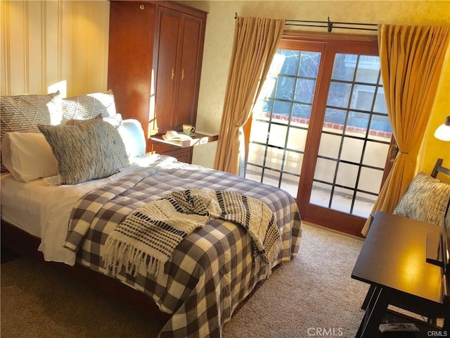 bedroom featuring light carpet