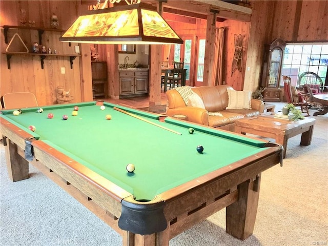 game room featuring wooden walls, carpet floors, a healthy amount of sunlight, and pool table