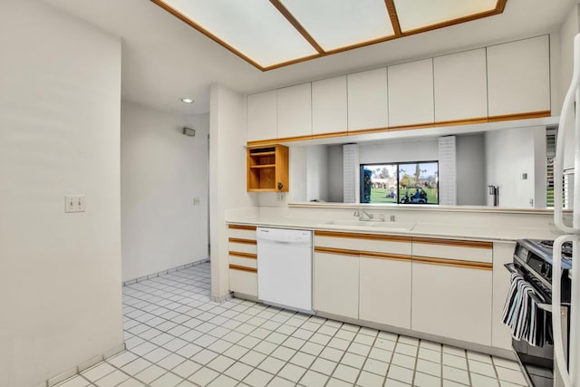 kitchen featuring white dishwasher, white cabinets, sink, and range with gas cooktop