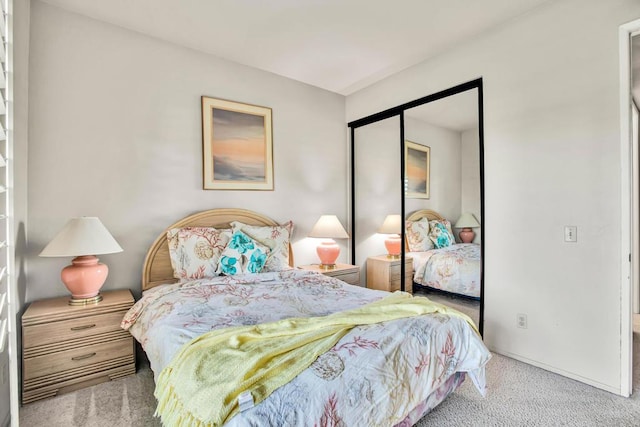 carpeted bedroom with a closet