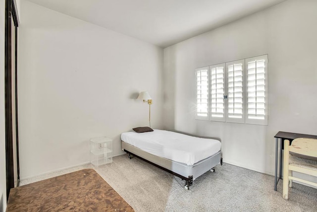 bedroom featuring light carpet