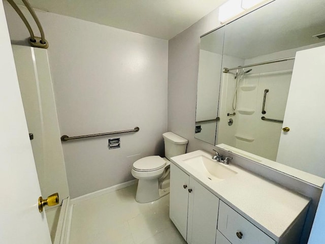 bathroom with toilet, vanity, and walk in shower