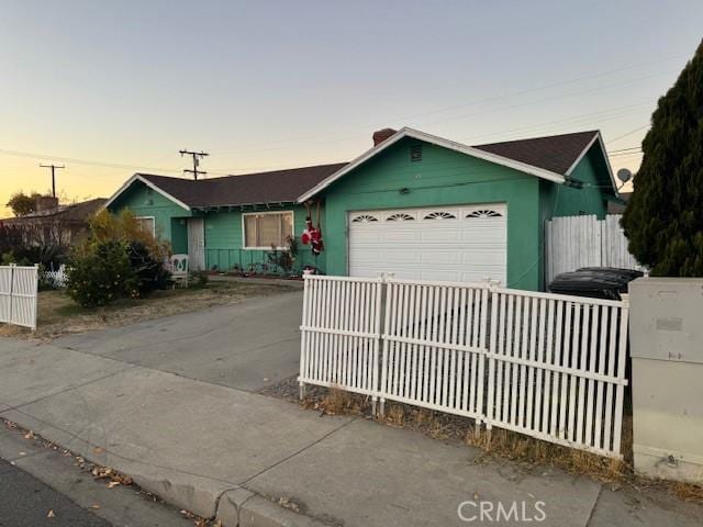 single story home with a garage