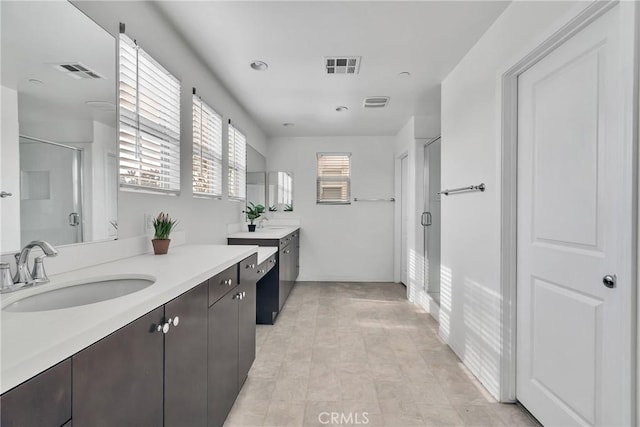 bathroom featuring vanity and an enclosed shower