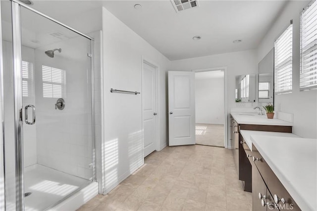 bathroom with vanity and an enclosed shower