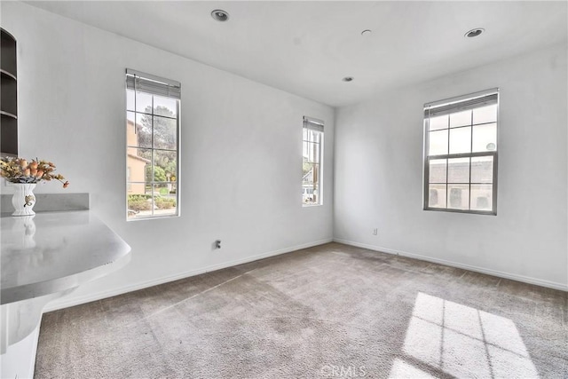 unfurnished room with carpet floors