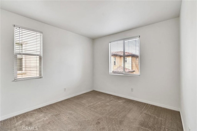 spare room featuring carpet flooring