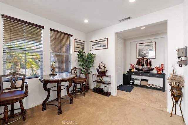 living area with light carpet