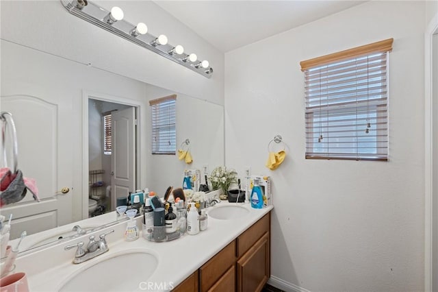 bathroom with vanity and toilet