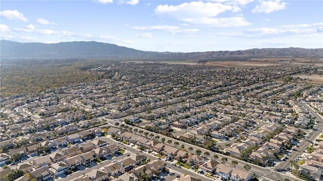 birds eye view of property with a mountain view