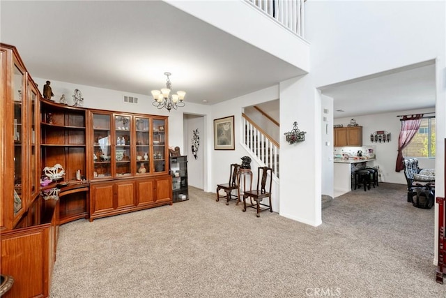 office area with light colored carpet and an inviting chandelier