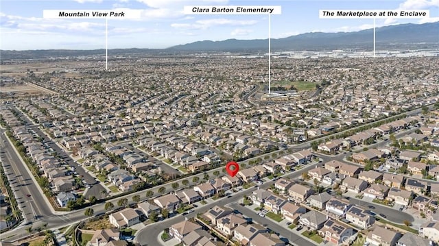 birds eye view of property with a mountain view