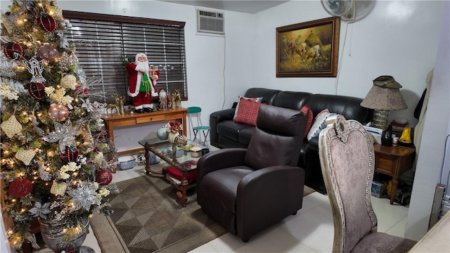 living room with light tile patterned floors and a wall mounted AC