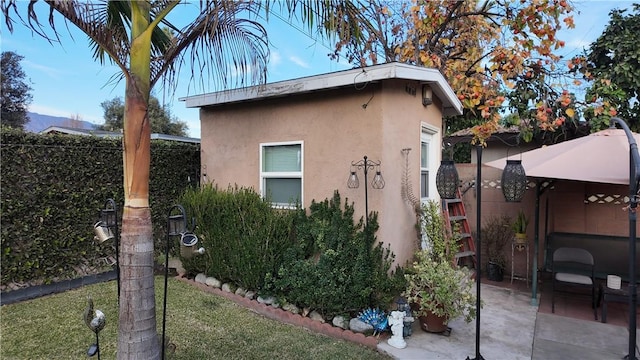 view of home's exterior with a patio