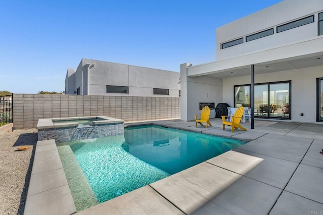 view of pool with a patio area, a fenced backyard, and a pool with connected hot tub