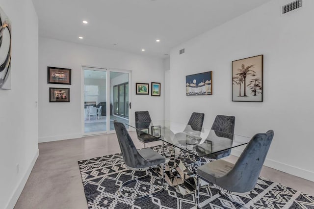 dining space featuring baseboards, finished concrete flooring, visible vents, and recessed lighting