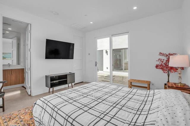 bedroom with finished concrete flooring, baseboards, ensuite bath, and recessed lighting