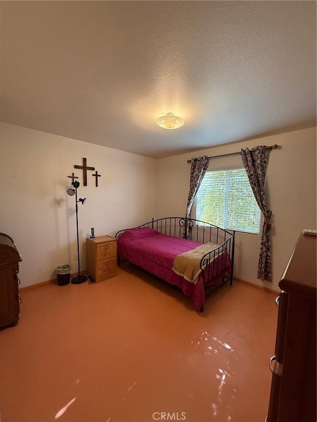 bedroom featuring a textured ceiling