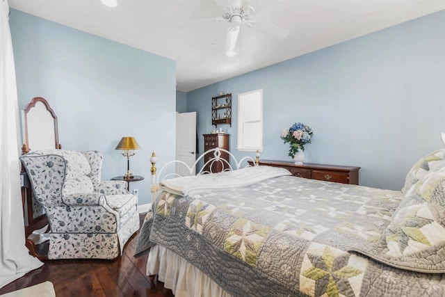 bedroom featuring ceiling fan and dark hardwood / wood-style floors