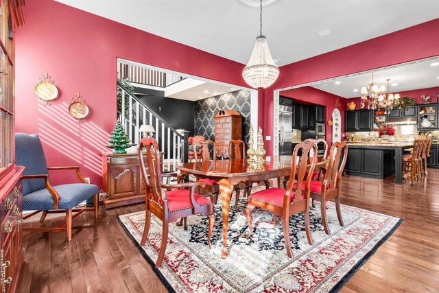 dining area with a chandelier and hardwood / wood-style flooring