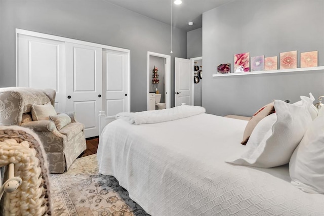 bedroom featuring hardwood / wood-style floors and a closet