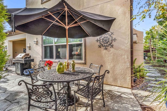 view of patio with a grill