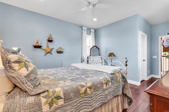 bedroom with ceiling fan and dark hardwood / wood-style flooring