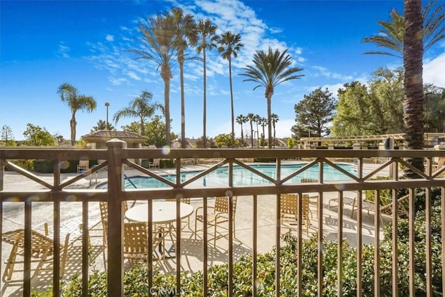 view of gate with a community pool