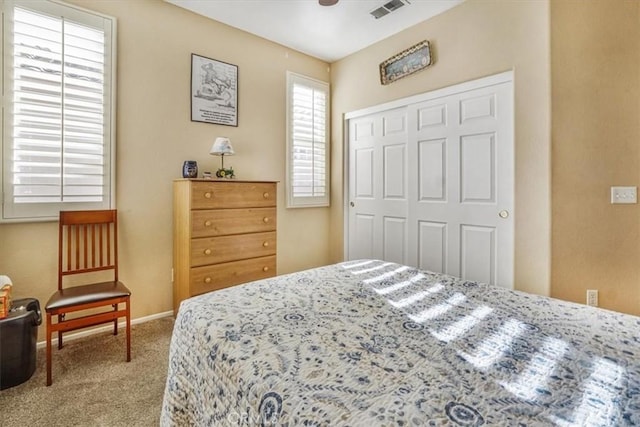 carpeted bedroom featuring a closet