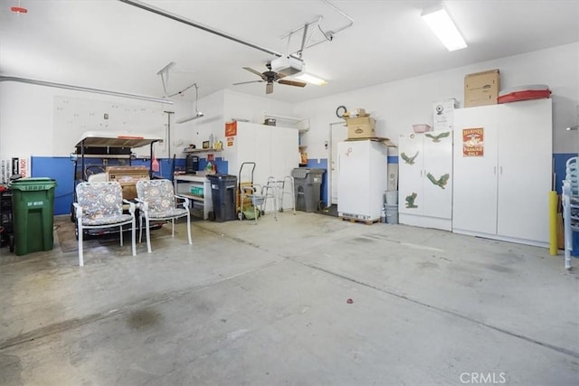 garage featuring ceiling fan and a garage door opener